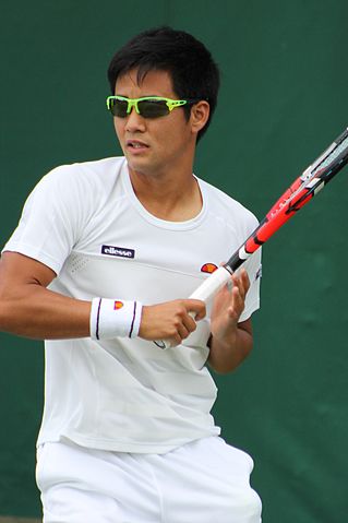 male tennis pro with sunglasses on