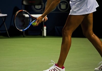 pro female tennis player serving