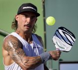 pro player Tyson hitting a ball with the power air paddle