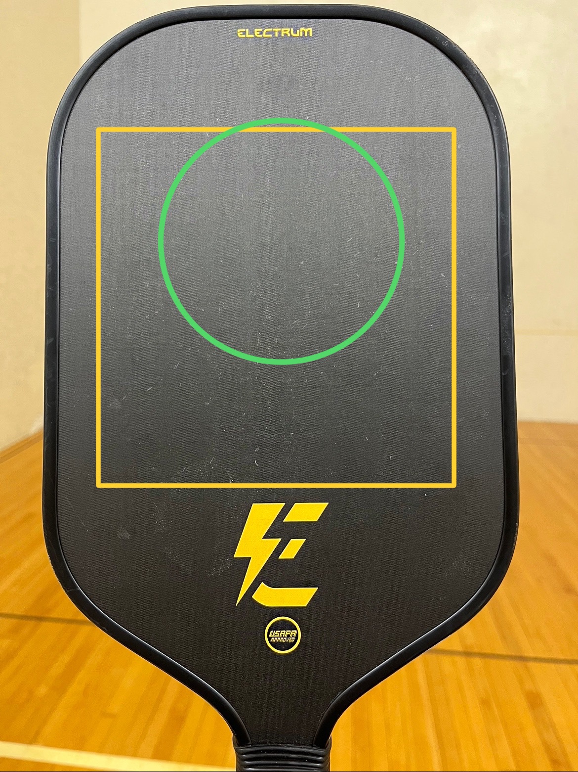 The Electrum Model E 16mm paddle with sweet spot shown on a table