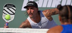 Pro player hitting a pickleball