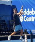 Jaume hitting a pickleball on the court