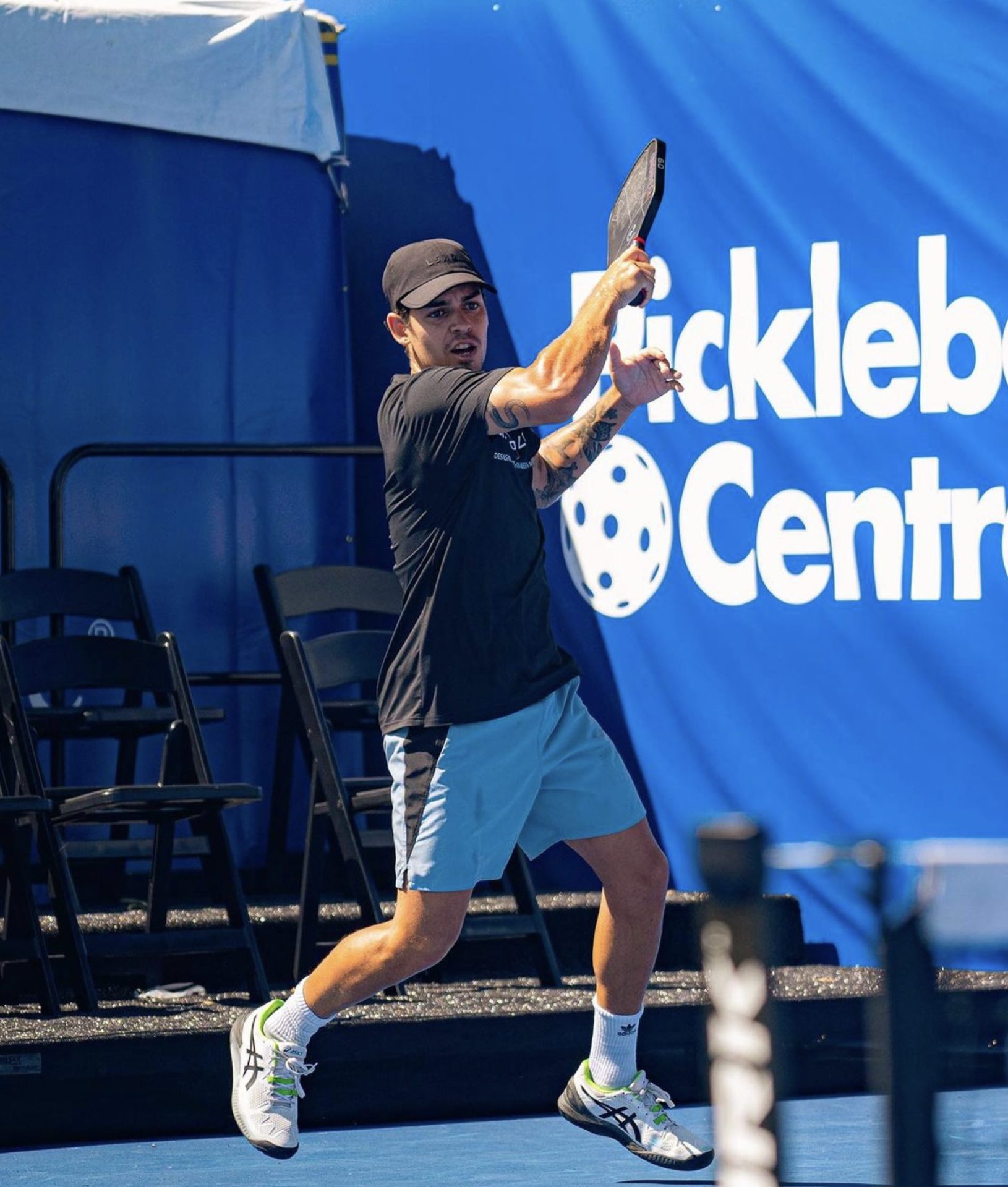 Jaume hitting a pickleball on the court
