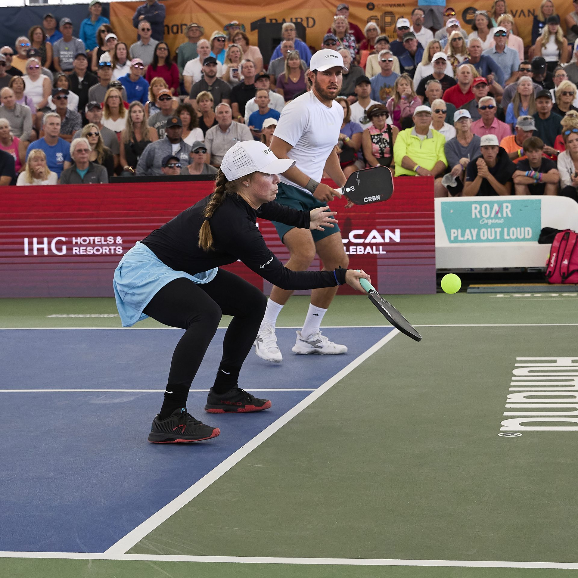 Thomas and David hitting a pickleball
