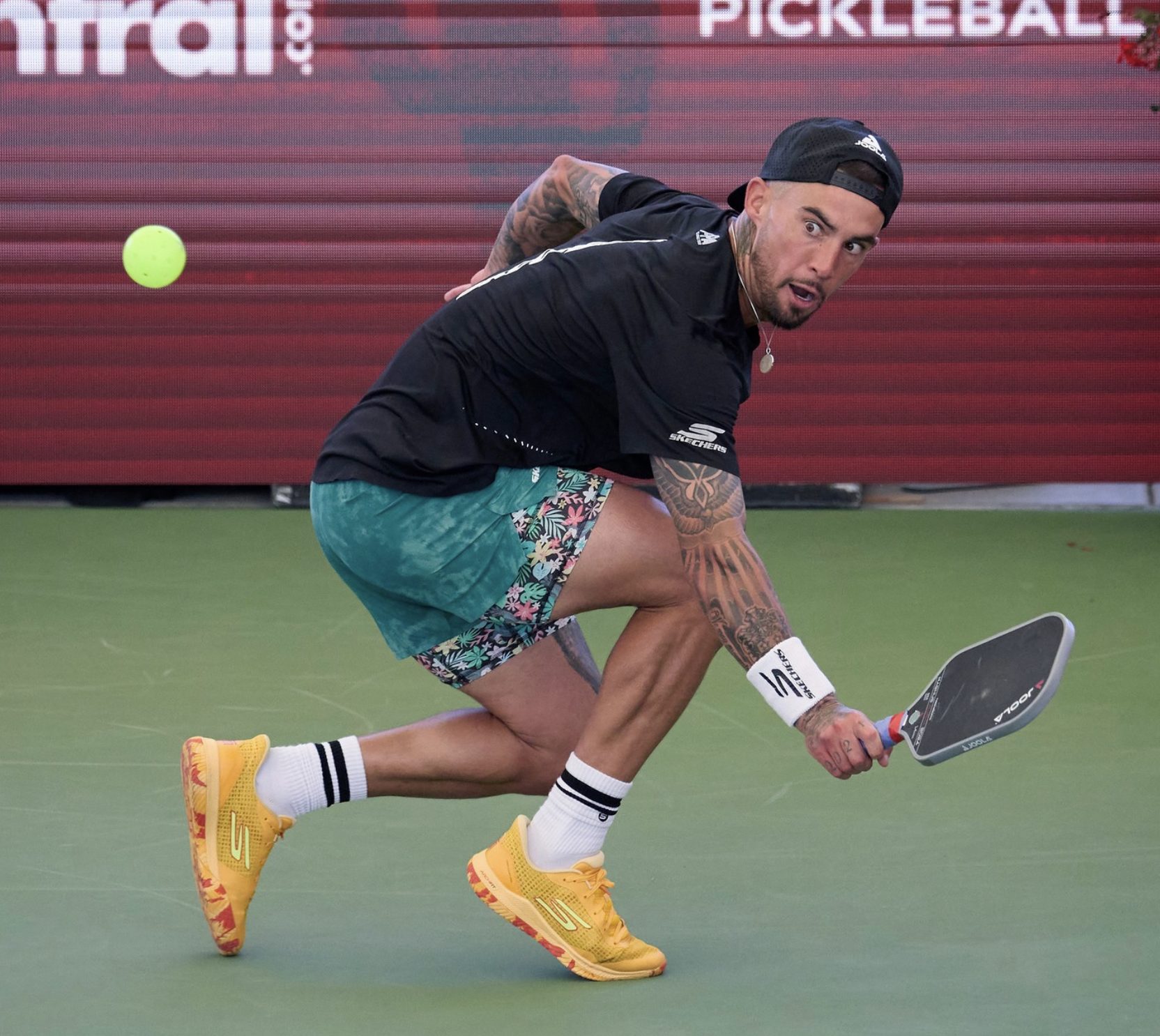 Tyson Mcguffin reaching for a ball in Mesa