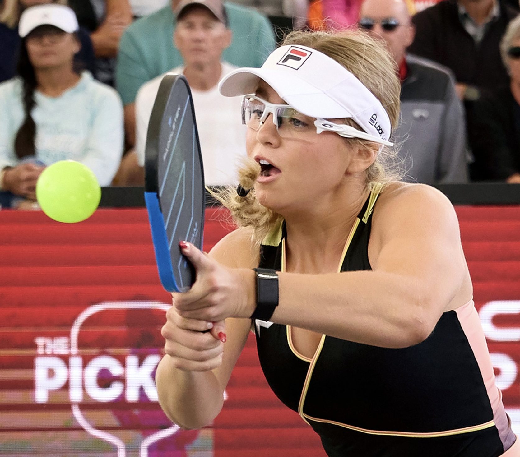 Anna Leigh Waters reaching for a pickleball